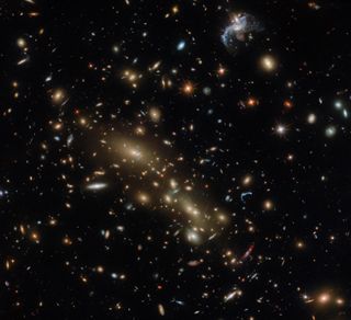 a spattering of galaxies litters the black of space.