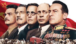 The Death of Stalin cast lines up in front of the Soviet flag