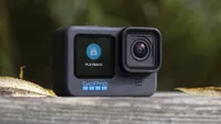 The GoPro Hero 10 Black action camera sitting on a wooden bench