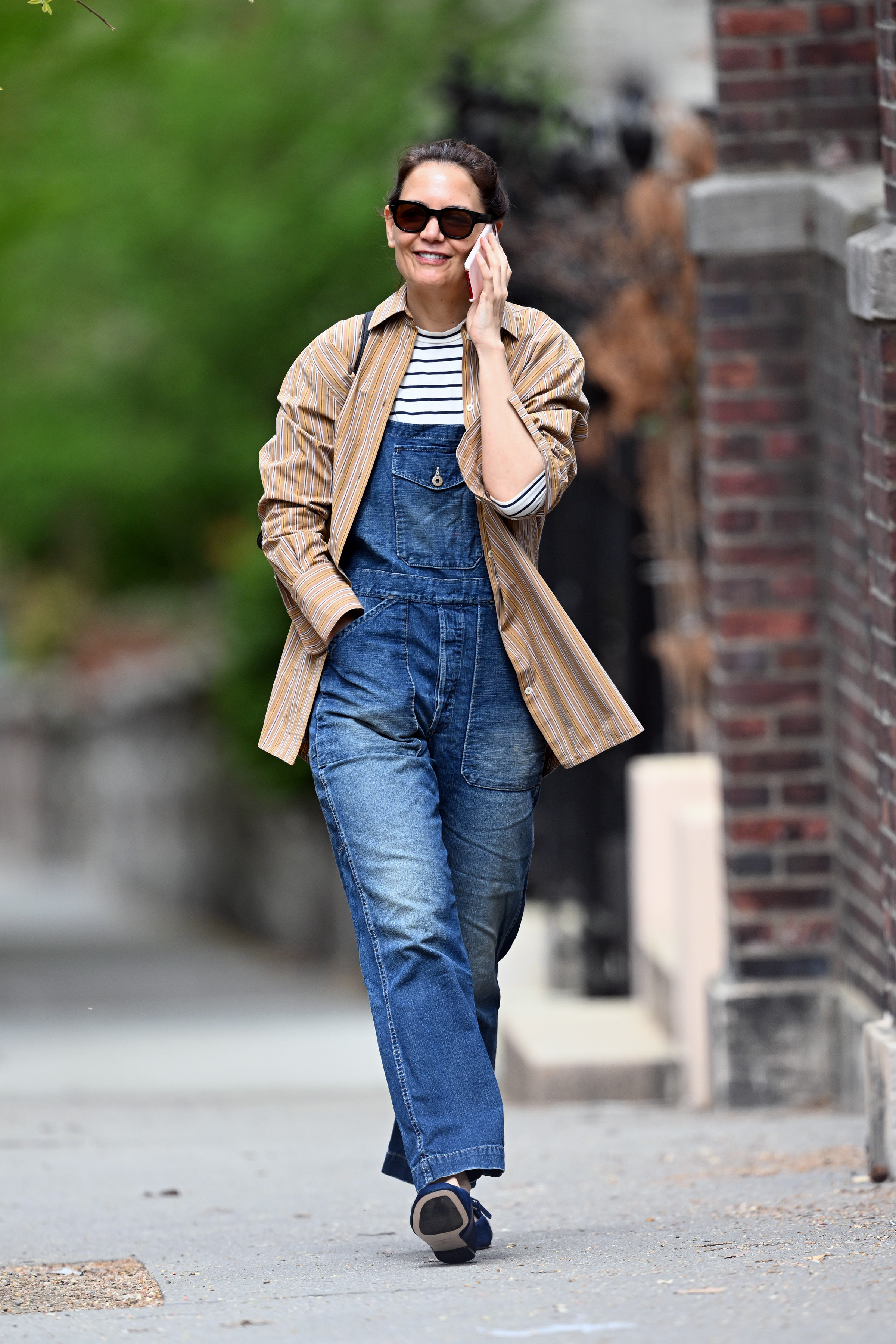 Katie Holmes styled denim overalls in April 2025