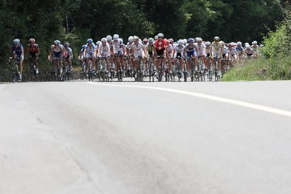 The bunch closes in on Megan Guarnier (USA).