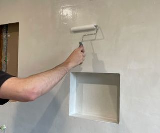 applying sealer to microcemented walls