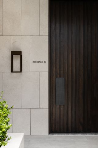 Stone and wood entrance at armadale residence in australia