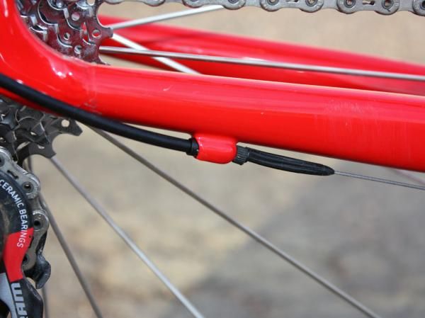 A small rubber gasket helps seal up the rear section of derailleur housing.