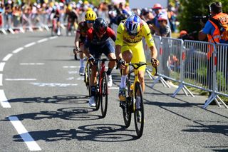 CALAIS FRANCE JULY 05 Wout Van Aert of Belgium and Team Jumbo Visma Yellow Leader Jersey attacks in the breakaway ahead of Adam Yates of United Kingdom and Team INEOS Grenadiers during the 109th Tour de France 2022 Stage 4 a 1715km stage from Dunkerque to Calais TDF2022 WorldTour on July 05 2022 in Calais France Photo by Tim de WaeleGetty Images