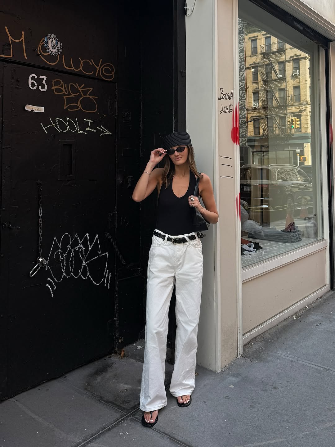 woman wearing white trousers black belt fall outfits 2025
