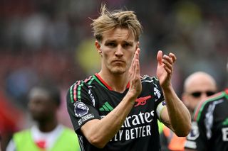 Arsenal captain Martin Odegaard is looking over his shoulder at the Emirates