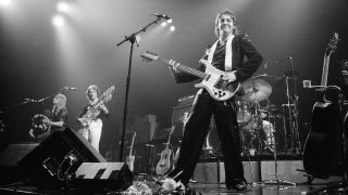 Paul McCartney, formerly of The Beatles, singing with Denny Laine of their group Wings in concert in USA, May 1976.