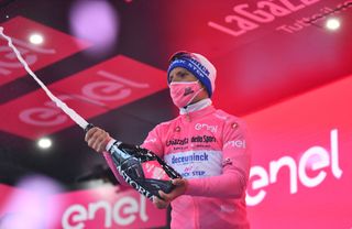 ROCCARASO ITALY OCTOBER 11 Podium Joao Almeida of Portugal and Team Deceuninck QuickStep Pink Leader Jersey Celebration Champagne during the 103rd Giro dItalia 2020 Stage 9 a 207km stage from San Salvo to Roccaraso Aremogna 1658m girodiitalia Giro on October 11 2020 in Roccaraso Italy Photo by Stuart FranklinGetty Images