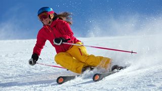 Woman downhill skiing