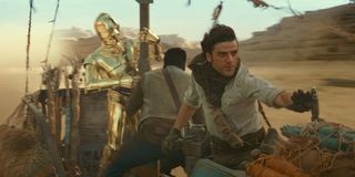 Poe, 3PO, and Finn in a desert