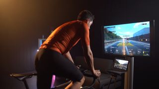 Rider using the BKOOL indoor cycling simulator