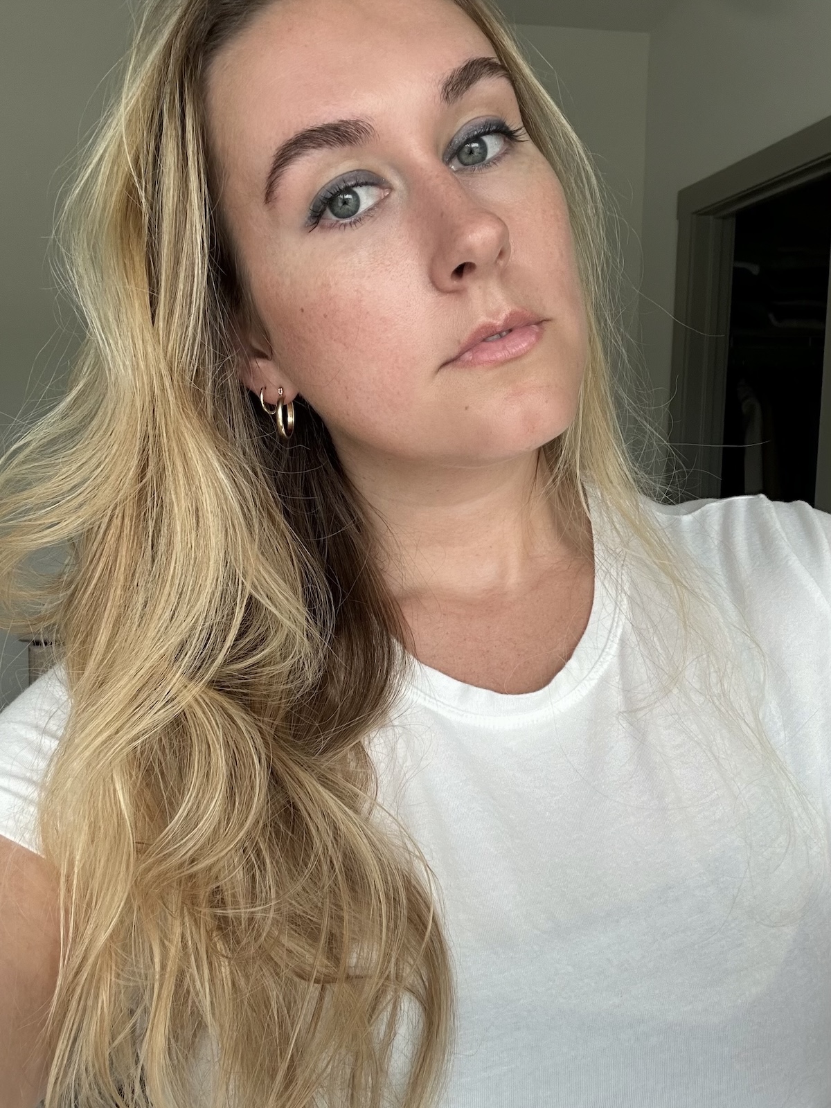 Beauty editor Kaitlyn McLintock wearing Victoria Beckham Beauty Satin Kajal Eyeliner in Navy Noir Pav&amp;eacute;.