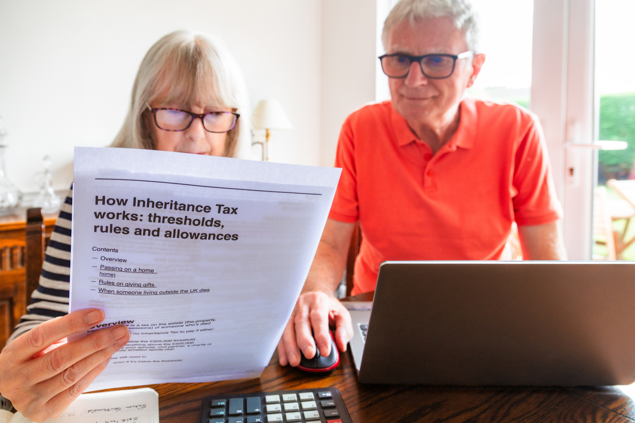 Senior couple looking at inheritance tax documents