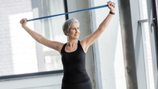 a woman working out with a resistance band