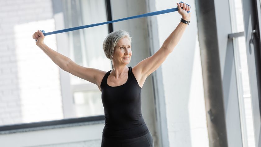 a woman working out with a resistance band