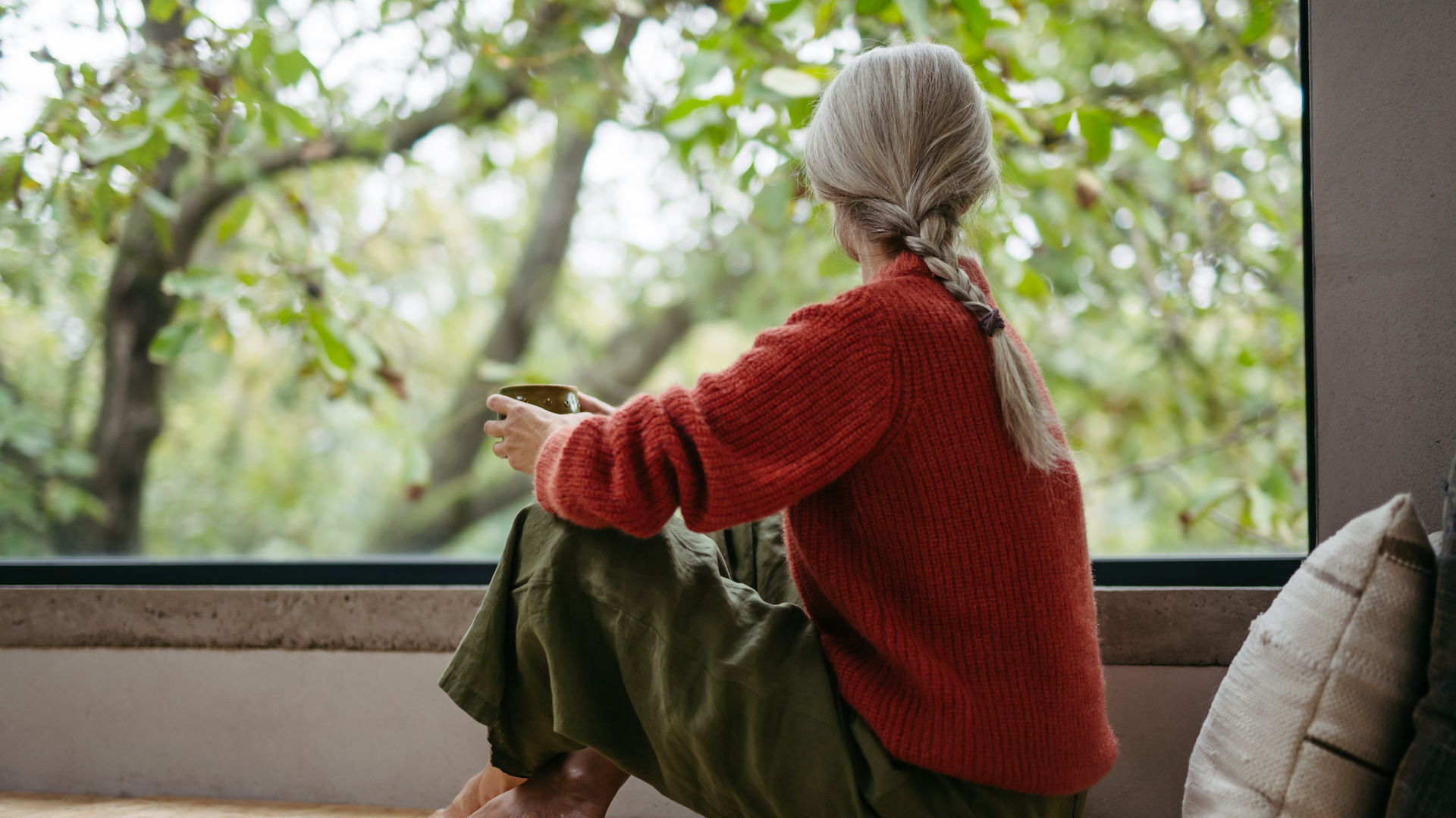 Woman looking out of window