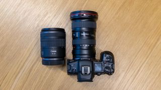 Canon RF 16-28mm F2.8 IS STM size comparison showing how much smaller it is than a Canon EF 16-35mm f/2.8L II USM lens on a Canon EOS R5 with Canon EF-EOS R adapter