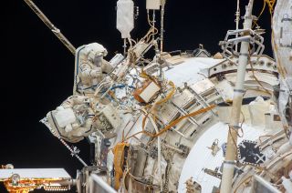 Cosmonauts Oleg Kotov and Sergey Ryazanskiy, as seen during their Dec. 27, 2013 spacewalk to install two UrtheCast cameras. The pair repeated the spacewalk Jan. 27, 2014 as a result of wiring and cabling issues with the cameras.