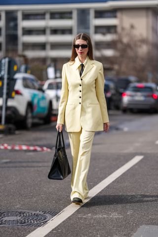 women wearing butter yellow at milan fashion week