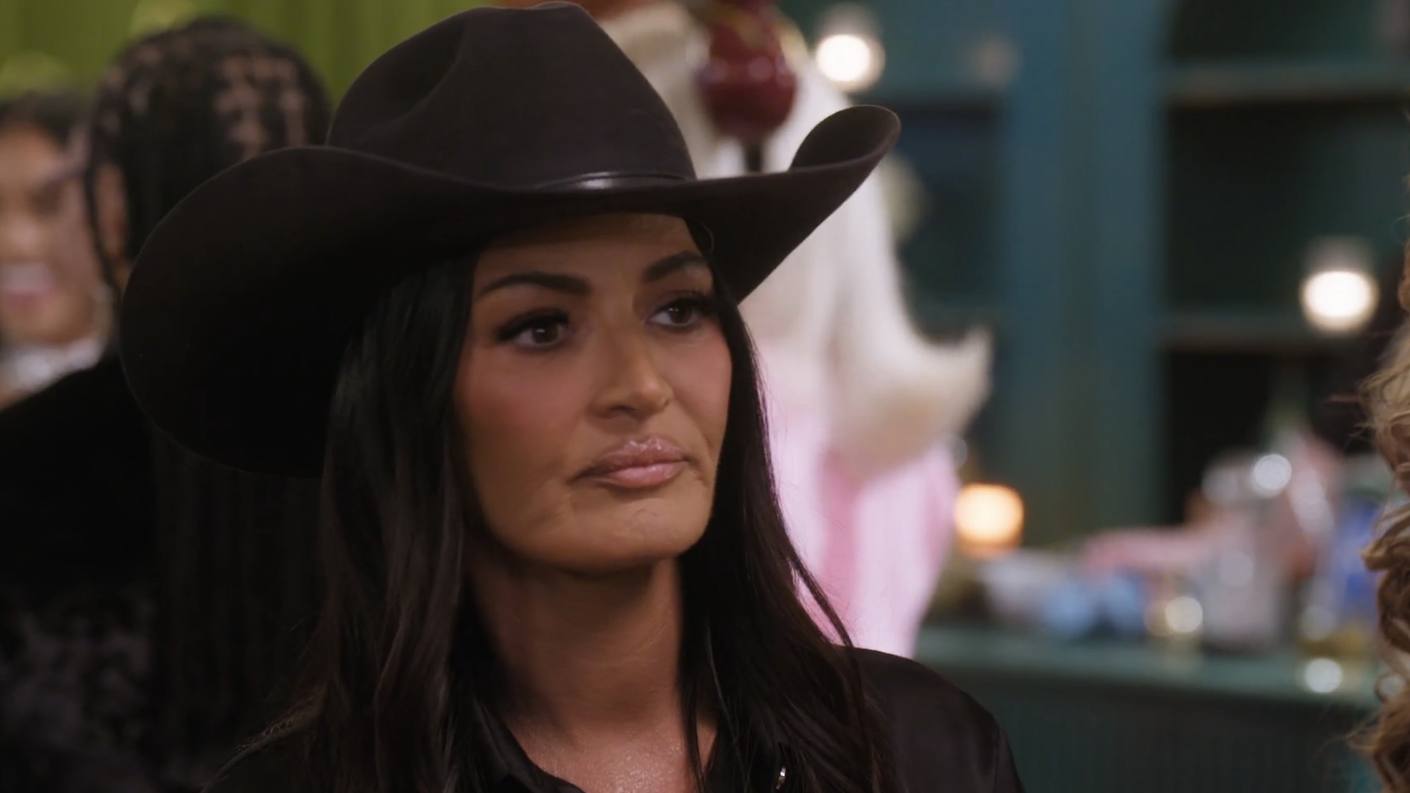 Lisa Barlow with a cowboy hat on Ultimate Girls Trip. 