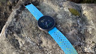 The Suunto Race S Courtney edition lying on a rock