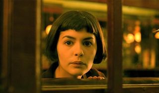 Amelie Audrey Tautou looking through a window