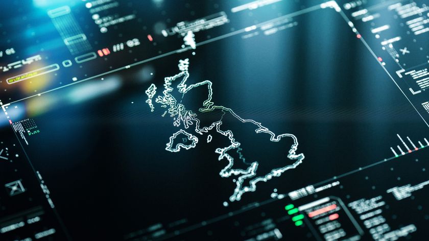 A futuristic, dark glossy instrument panel showing white a digital map of the UK surrounded by stats, diagnostics. 