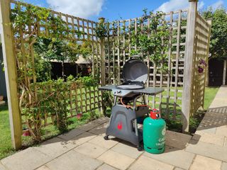 Char-Broil All-Star gas bbq in garden on patio in the sun