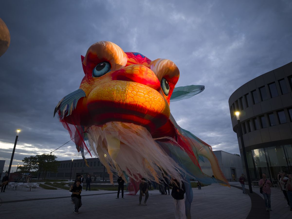 Insta360 Luna Ultra sample gallery: large inflated Chinese dragon in urban area at blue hour