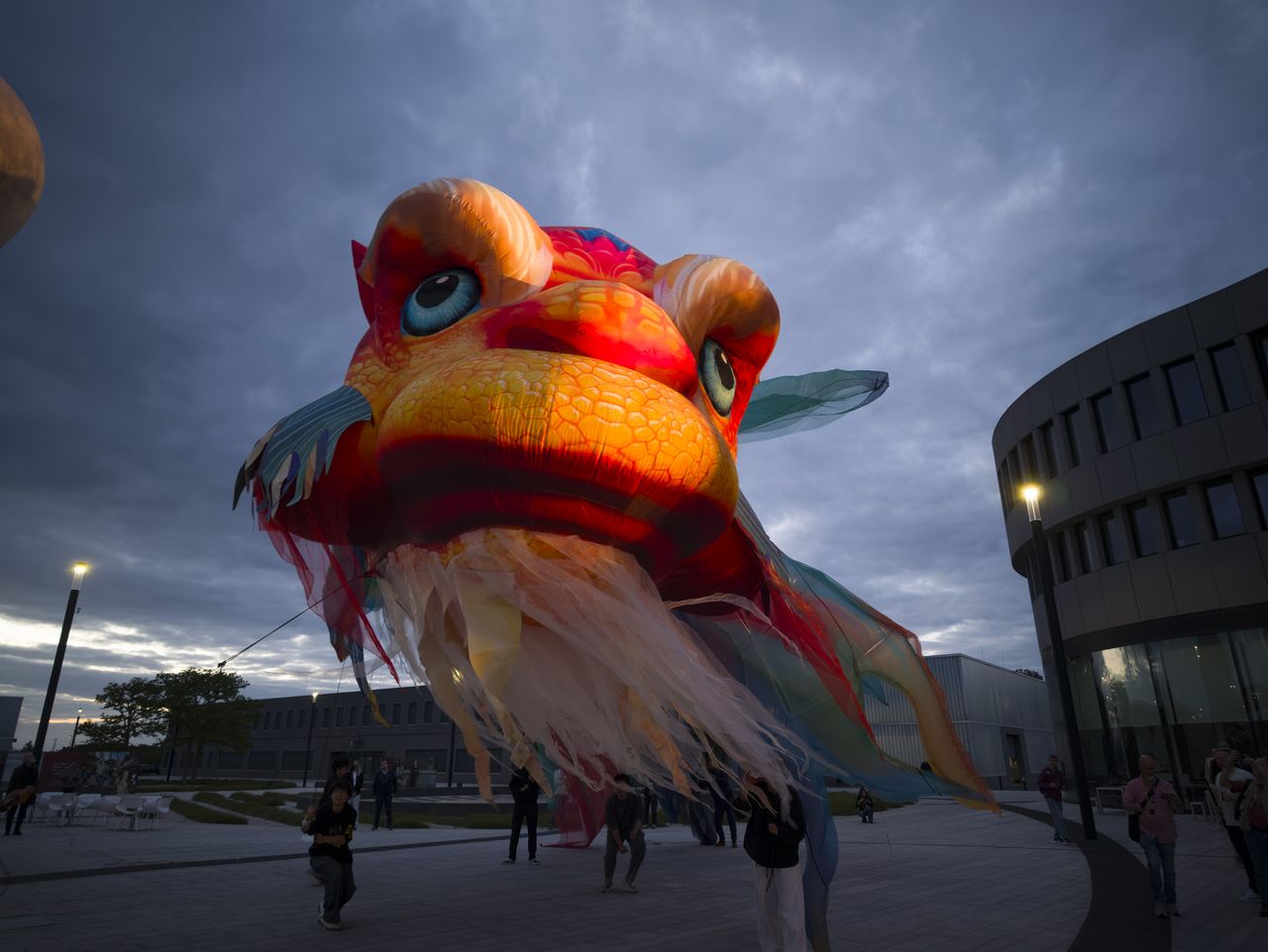 Insta360 Luna Ultra sample gallery: large inflated Chinese dragon in urban area at blue hour