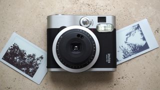 Product shot of a Fujifilm Instax Mini 90, one of the best instant cameras