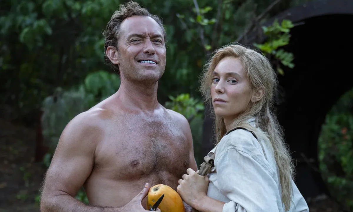 jude law and vanessa kirby on a tropical beach in the movie eden