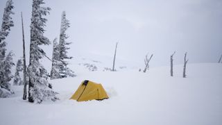 a tent pitched in snow