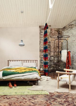 Rustic bedroom with exposed brick wall