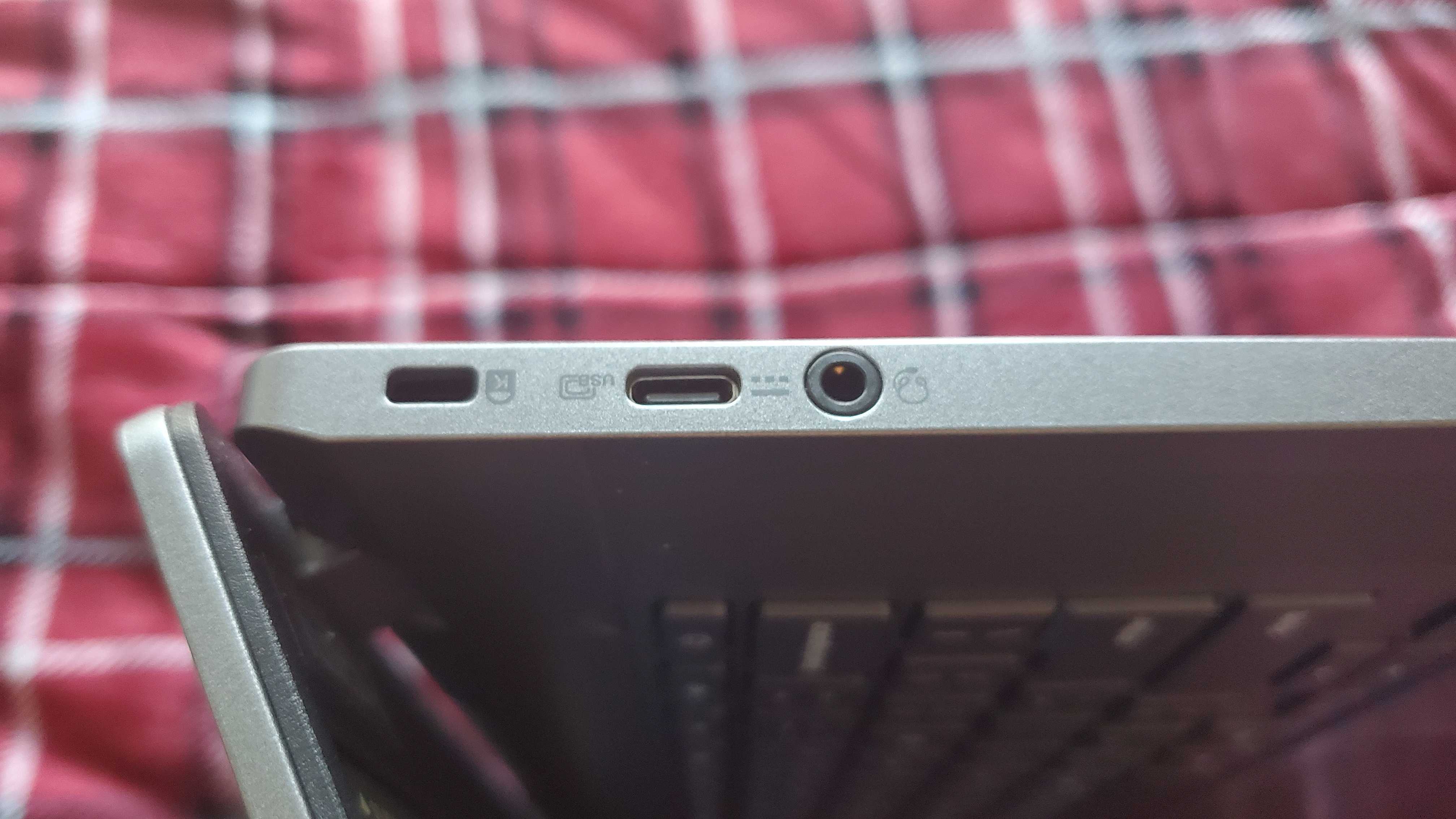 chromebook plus laptop sitting on bed