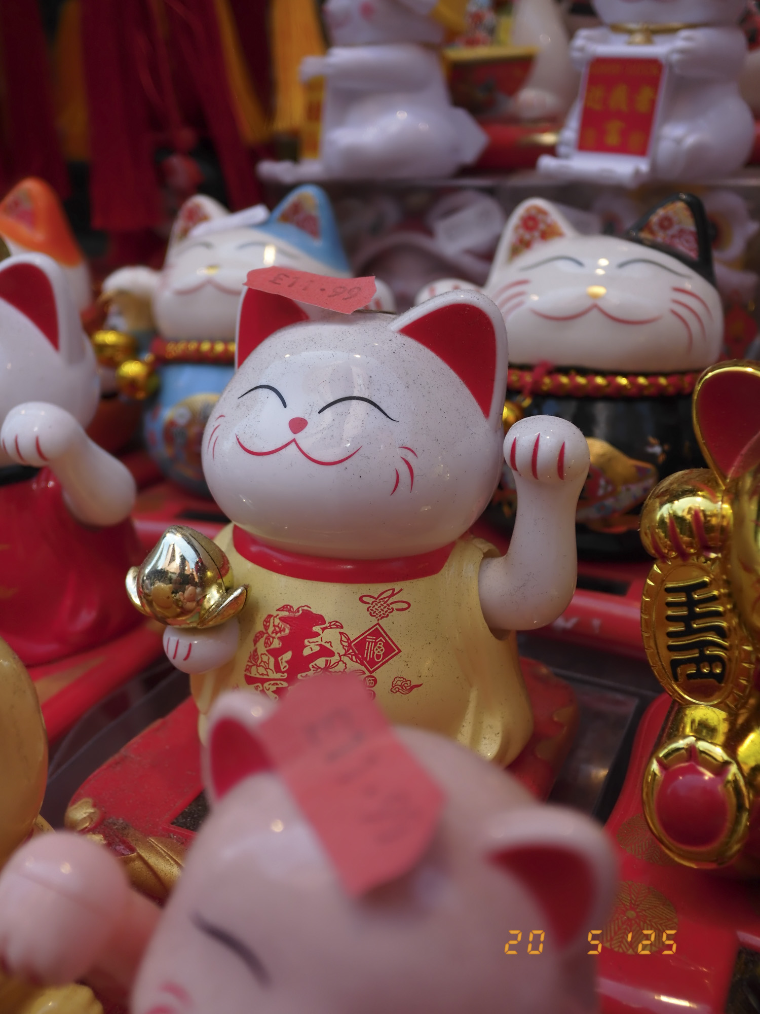 Closeup of maneki-neko in London's china town