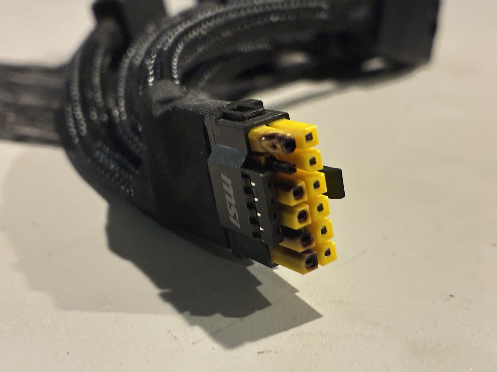 A post-DLSS 5 RTX 5090 suffering from a genetic disease known as its 16-pin connector melting