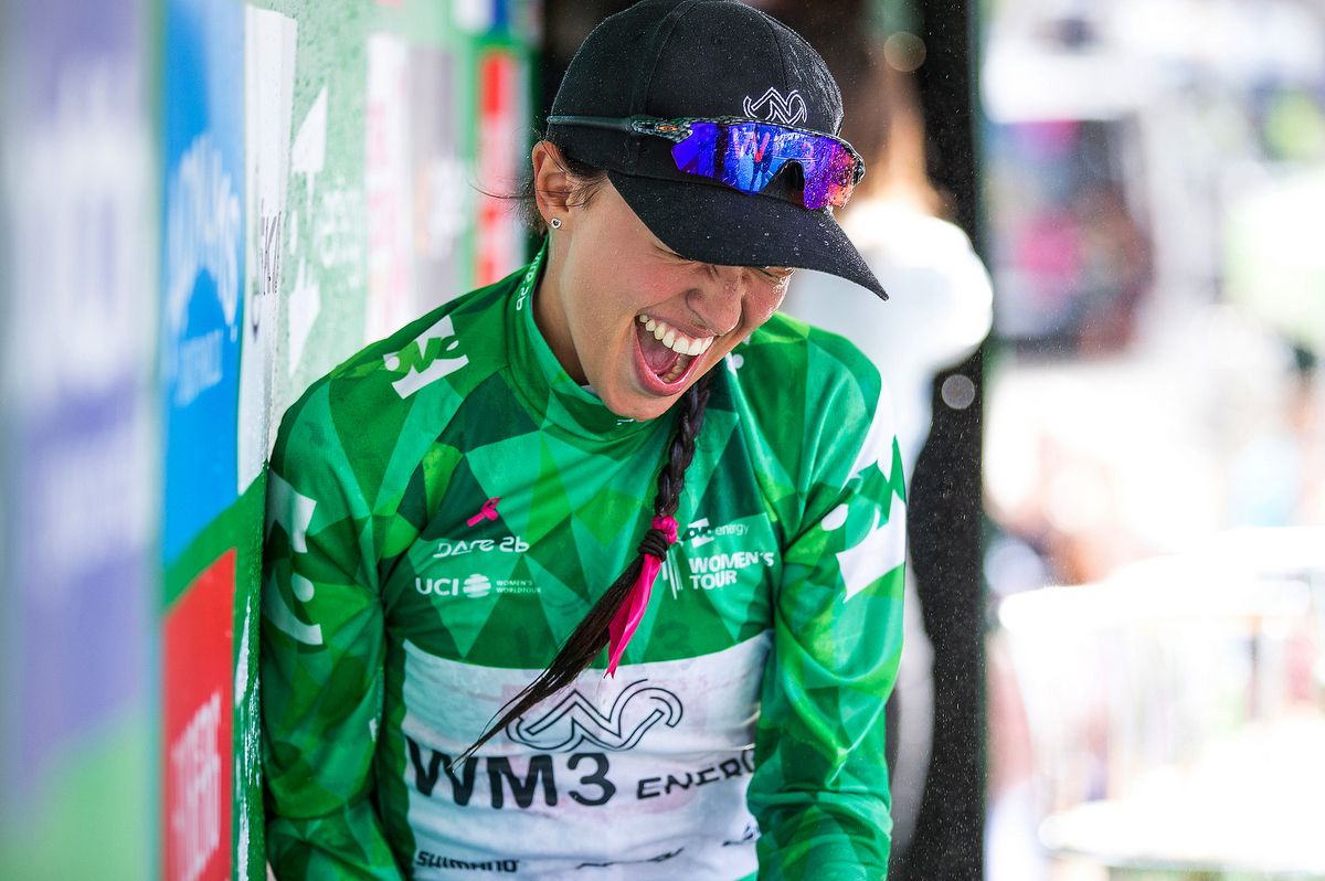 Katarzyna Niewiadoma tries to avoid the champagne