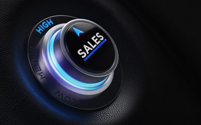 Finance and investment concept. Button on car dashboard. There is sales text on the button and it is pointing high efficiency. Horizontal composition with copy space and selective focus.