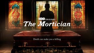 Person standing behind coffin with stain glass windows