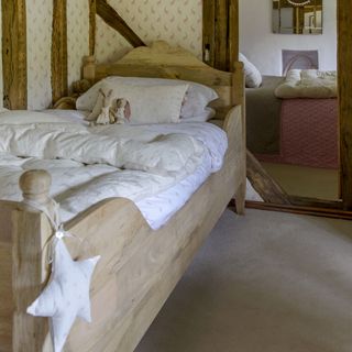 child's bedroom with carpet flooring and wooden bed