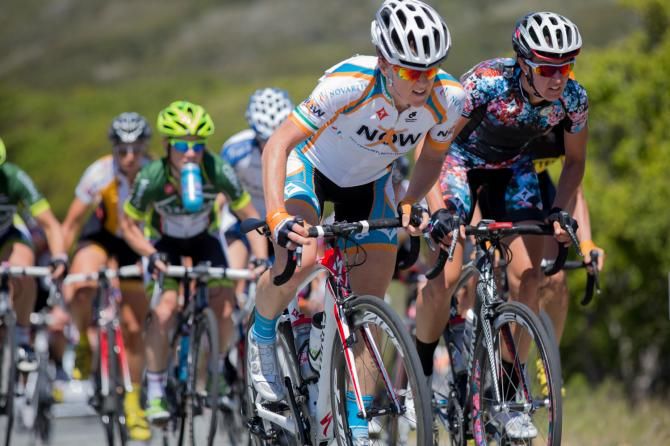 Oliva Dillon is shadowed by All Stacher on the second lap of the road race.