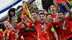 Alvaro Morata raises the Euro 2024 trophy alongside his team mates 