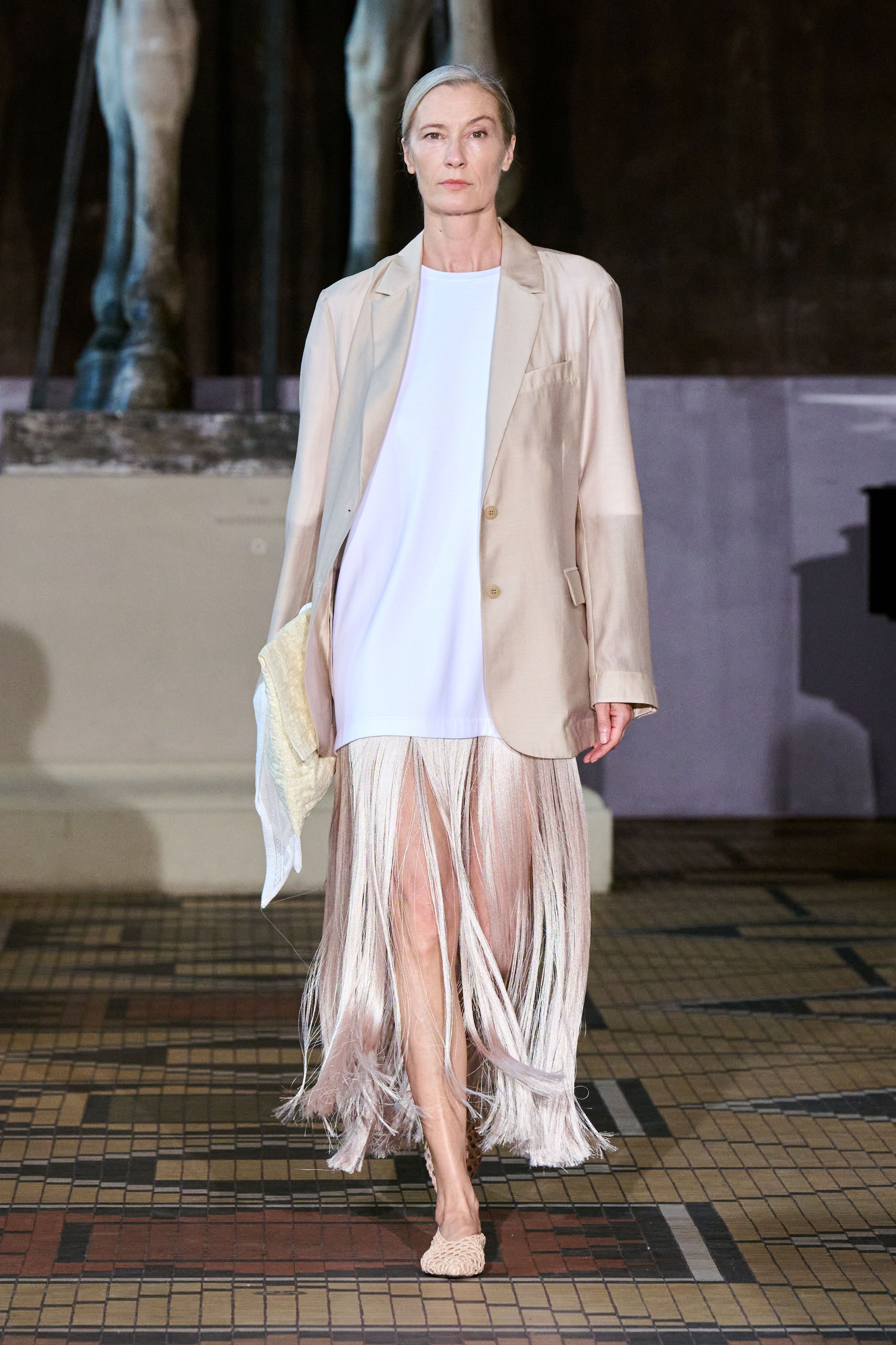 Spring 2027 Copenhagen Fashion Week looks featuring fringe and textured details in neutral tailoring from The Garment, Mr Larkin, MKDT Studio, and By Malene Birger.
