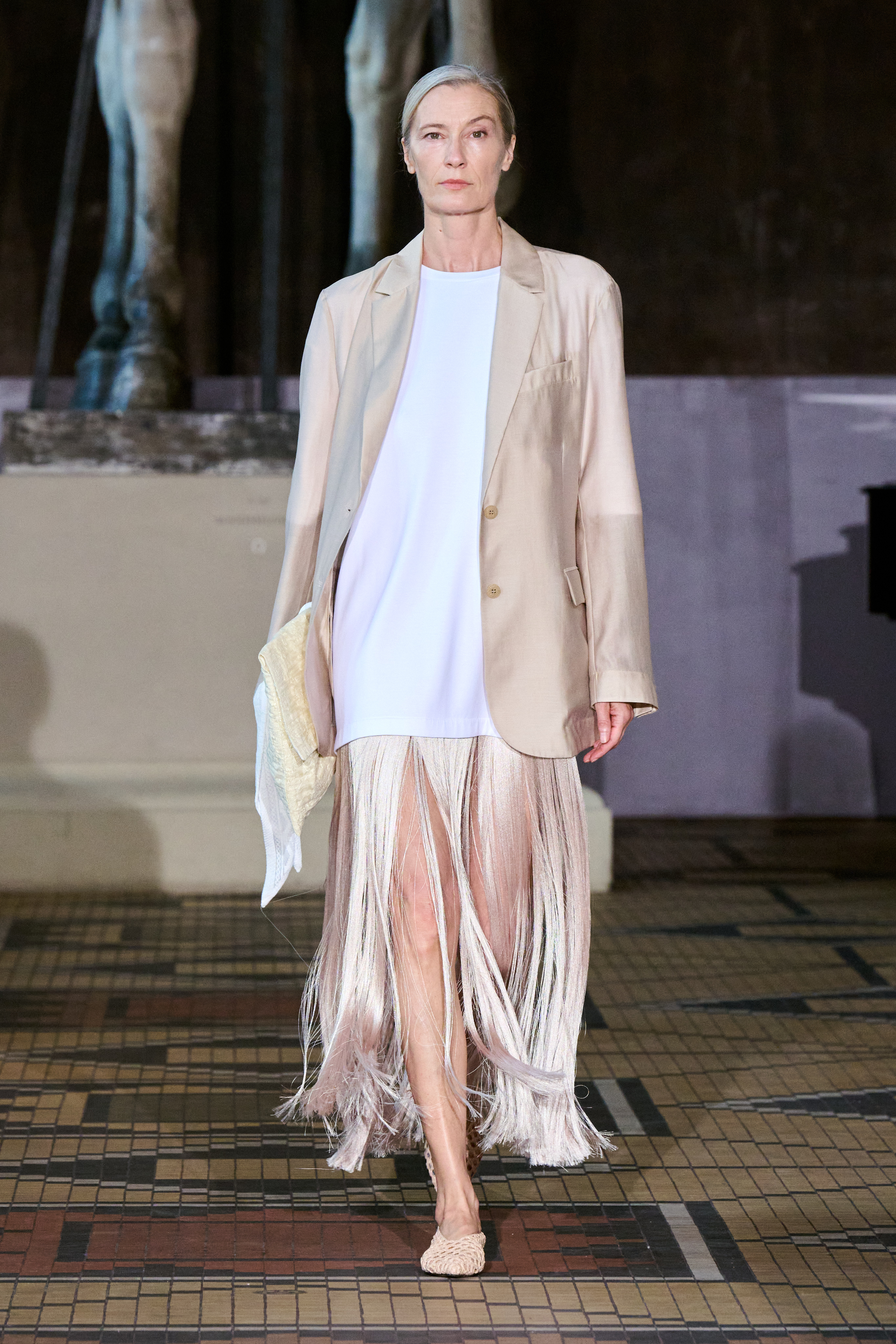 Spring 2027 Copenhagen Fashion Week looks featuring fringe and textured details in neutral tailoring from The Garment, Mr Larkin, MKDT Studio, and By Malene Birger.