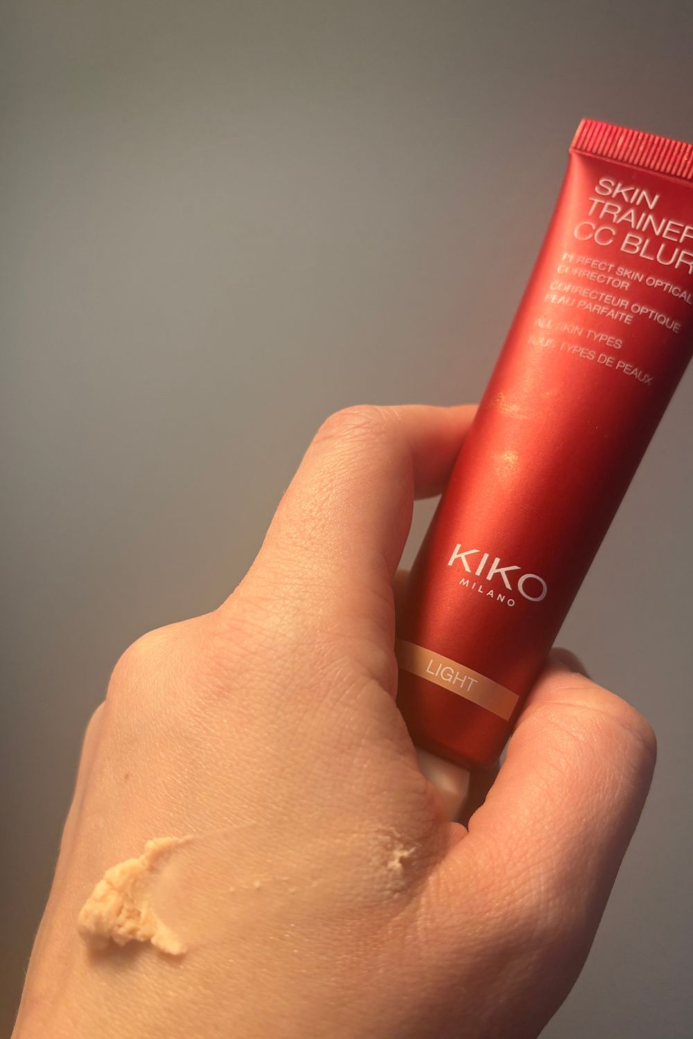 a hand holding kiko milano cc blur