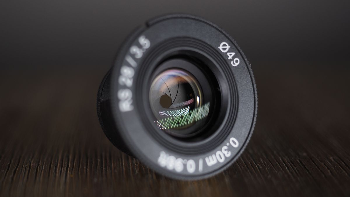 Samyang Remaster Slim lens on a wooden surface