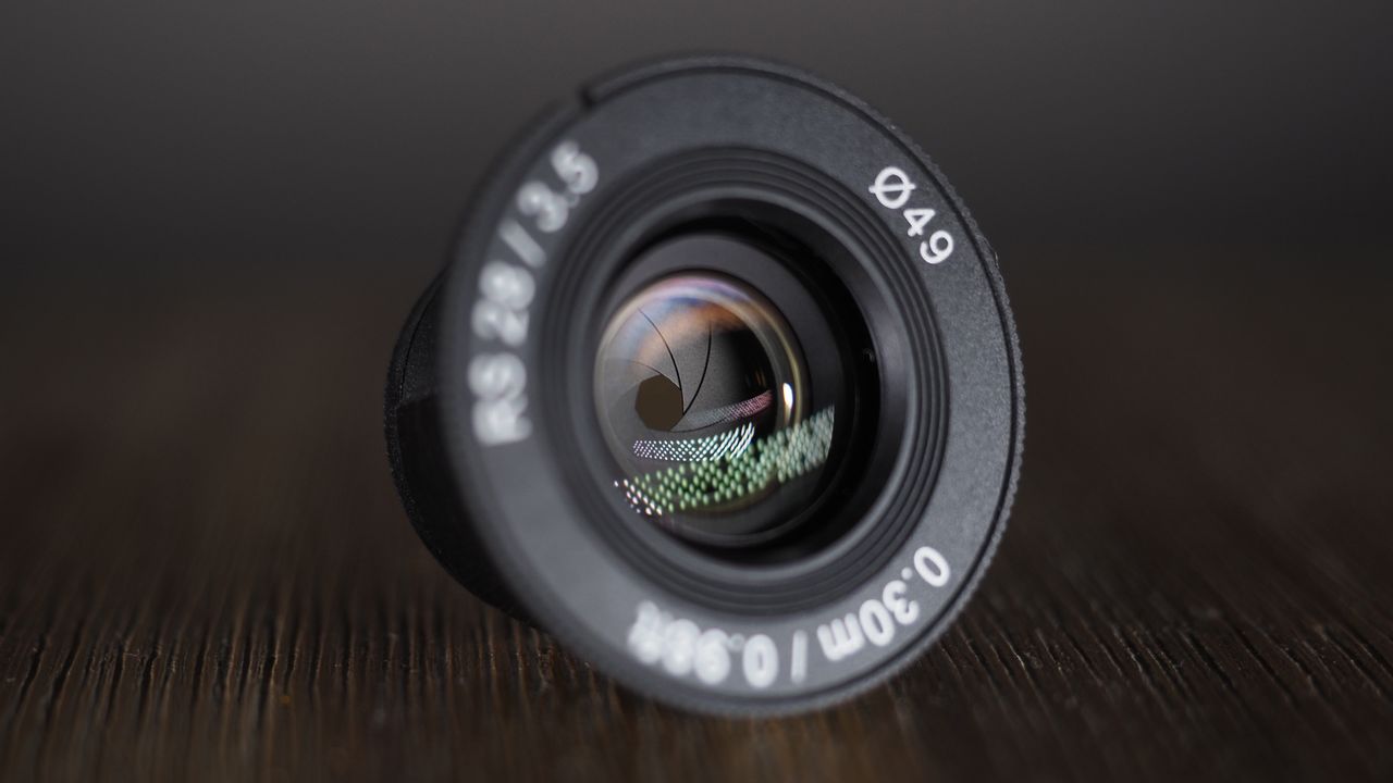 Samyang Remaster Slim lens on a wooden surface