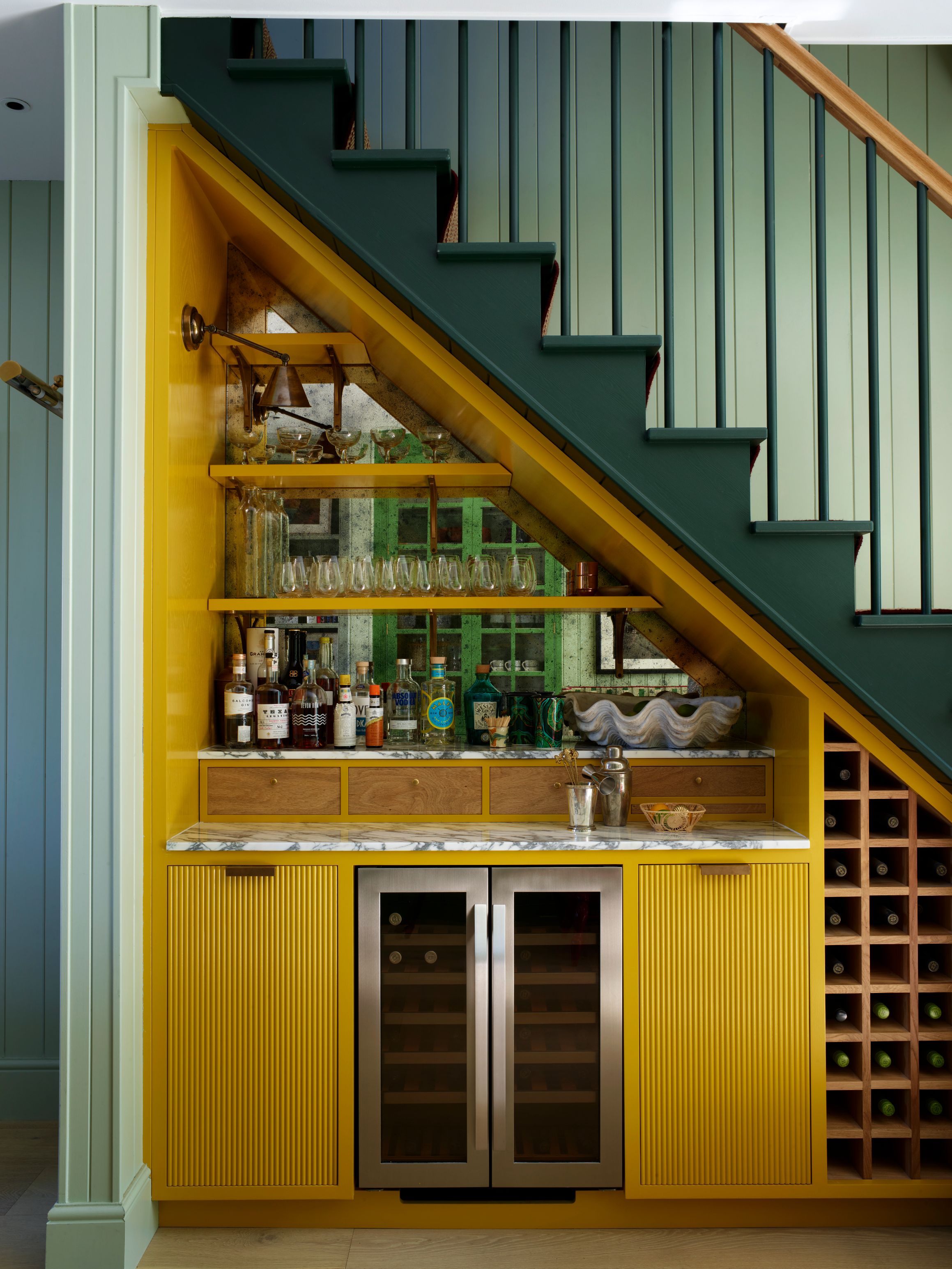A built-in bar area underneath a staircase